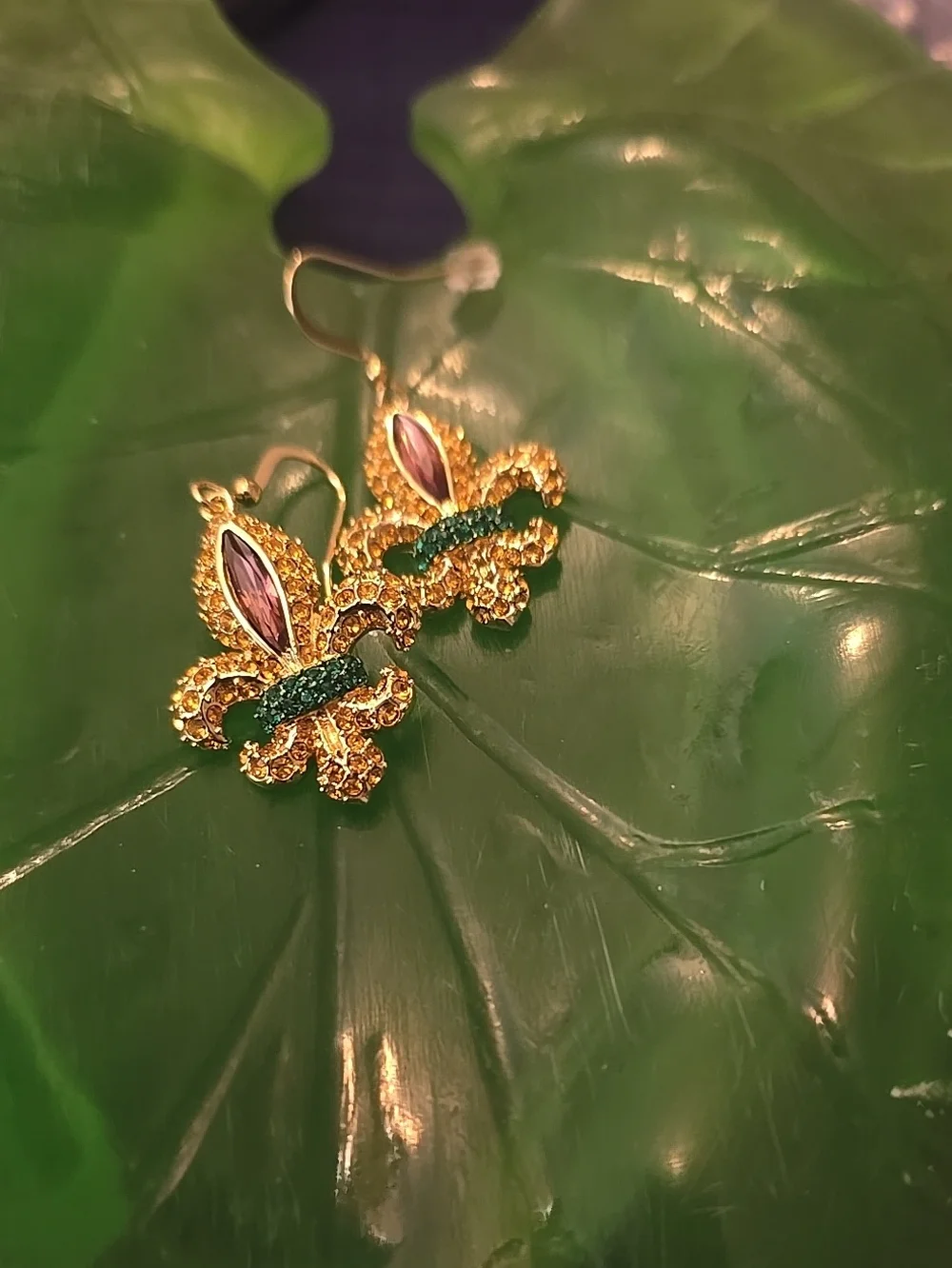 Gold Fleur-de-Lis Drop Earrings with Green and Purple Accents